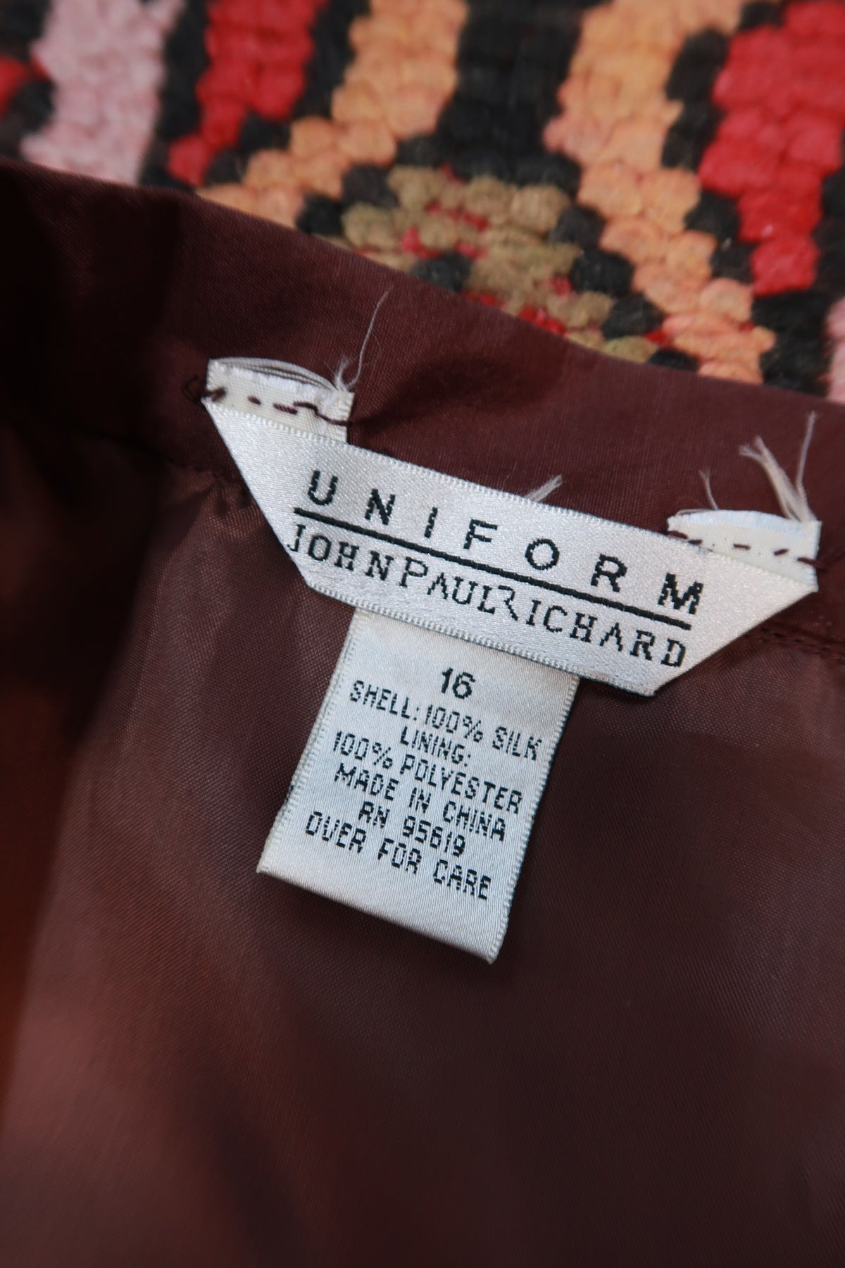 Chocolate brown silk embroidered mini skirt from Elektra Vintage, featuring intricate vintage embroidery and a stylish mini length.