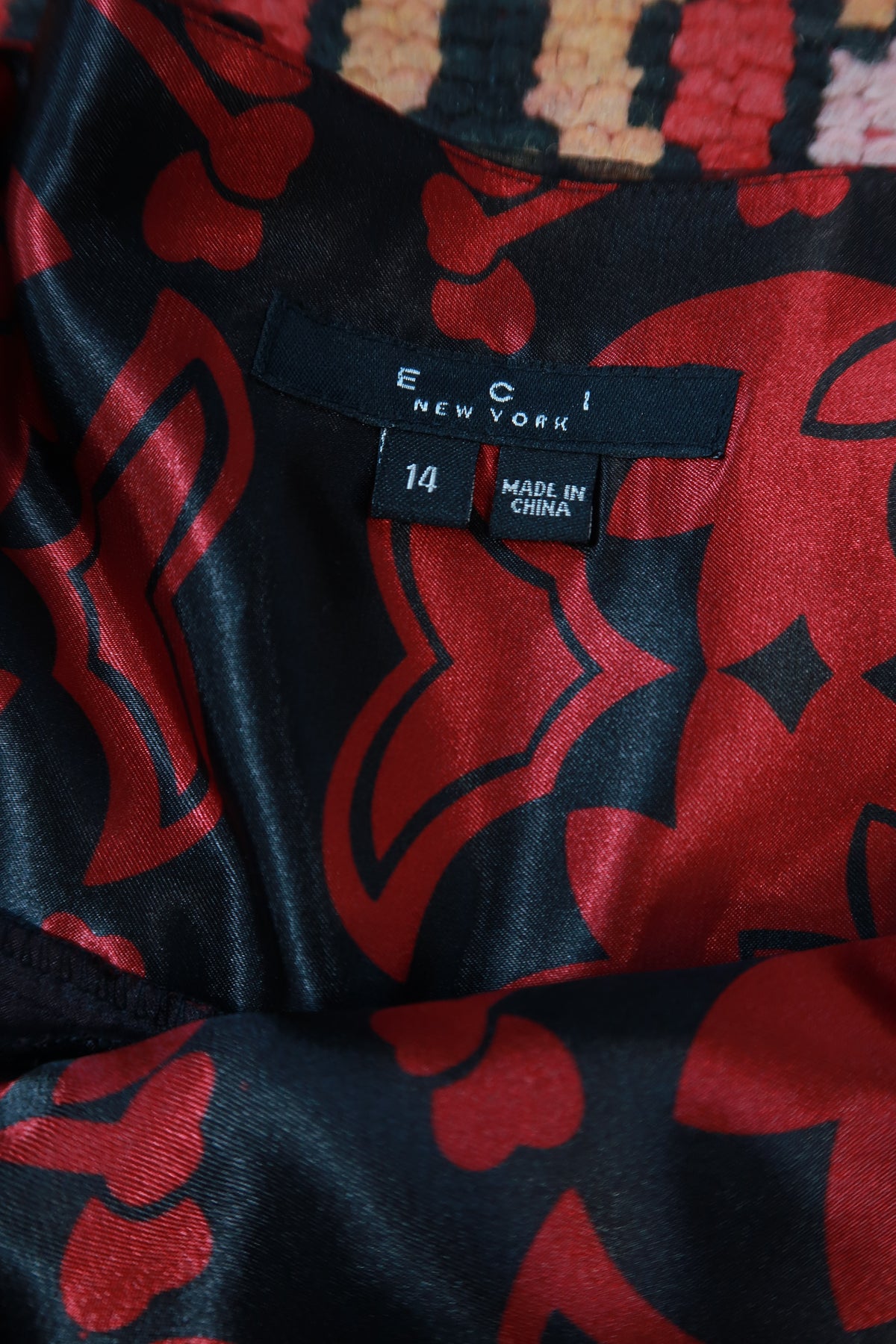 Black and red sheer silk floral ruffle mini skirt from Elektra Vintage, vintage 2000s style with feminine ruffle details.