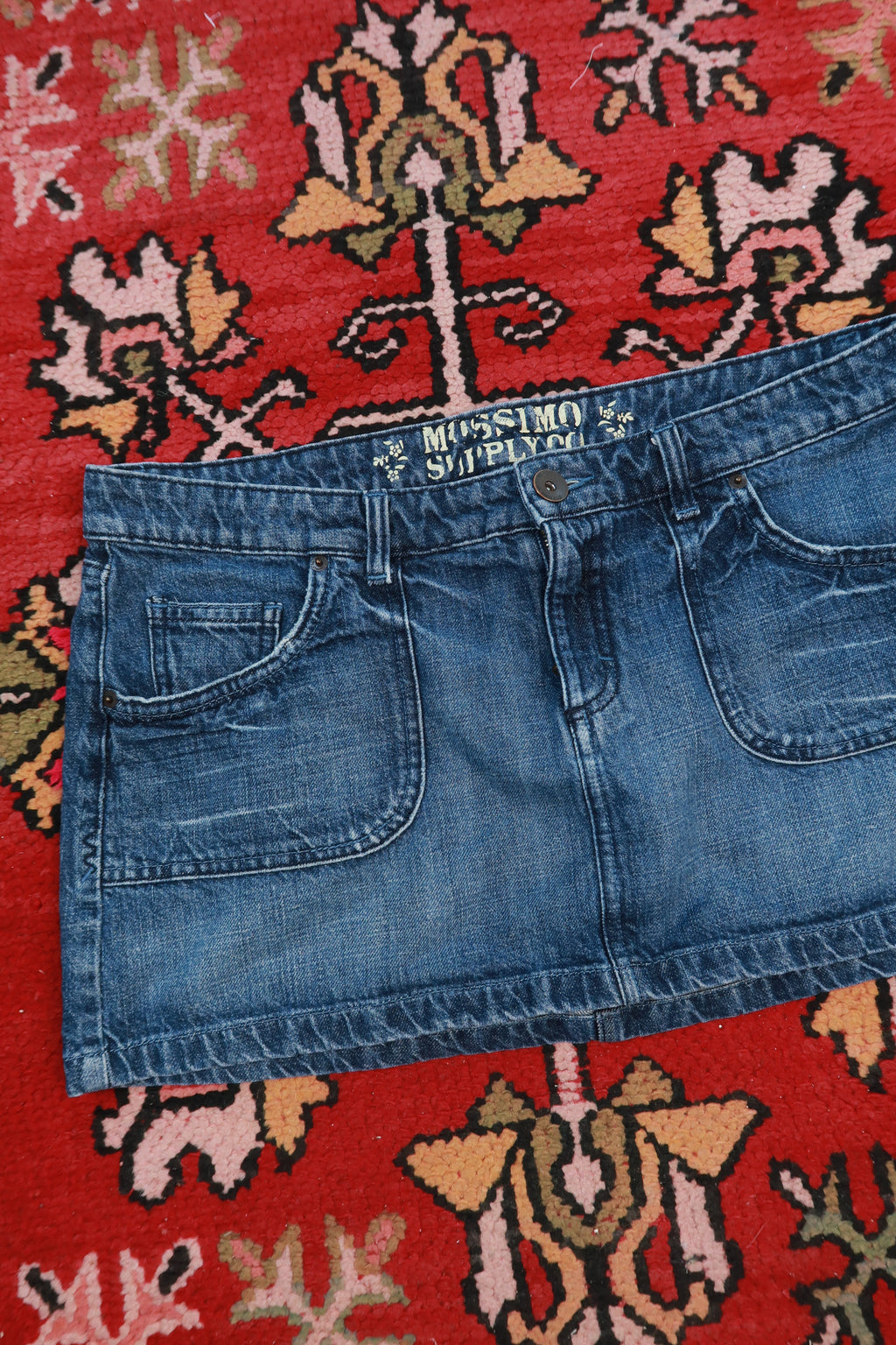 Vintage 2000s Mossimo low rise denim micro mini skirt from Elektra Vintage, showing the front view with classic denim details.