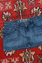 Load image into Gallery viewer, Vintage 2000s Mossimo low rise denim micro mini skirt from Elektra Vintage, showing the front view with classic denim details.
