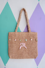 Load image into Gallery viewer, Vintage 2000s mini woven straw handbag with floral embellishments by Elektra Vintage, featuring a compact hand-held bag design.
