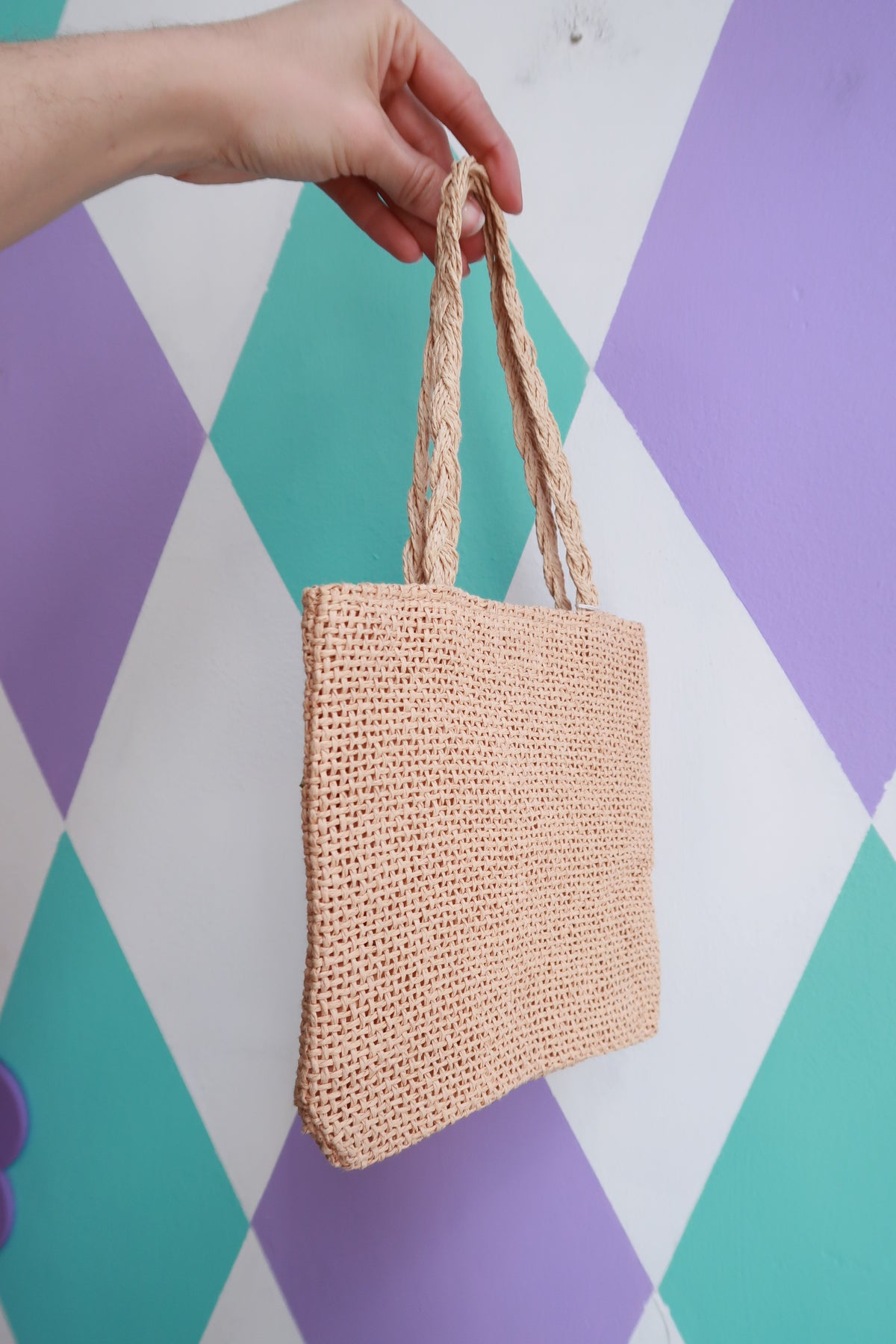 Vintage 2000s Elektra Vintage mini woven straw handbag with floral embellishments, featuring a compact and stylish design.