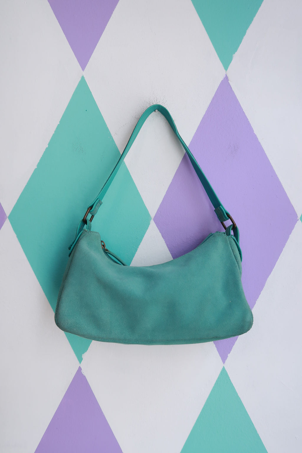 Vintage 2000s turquoise suede mini shoulder bag by Elektra Vintage, featuring a compact design with a shoulder strap.
