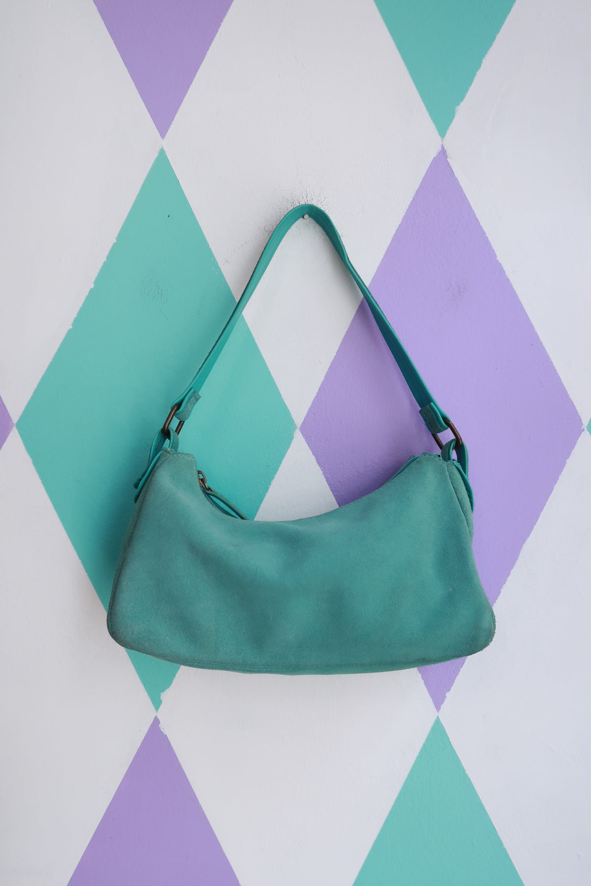 Vintage 2000s turquoise suede mini shoulder bag by Elektra Vintage, featuring a compact design with a shoulder strap.