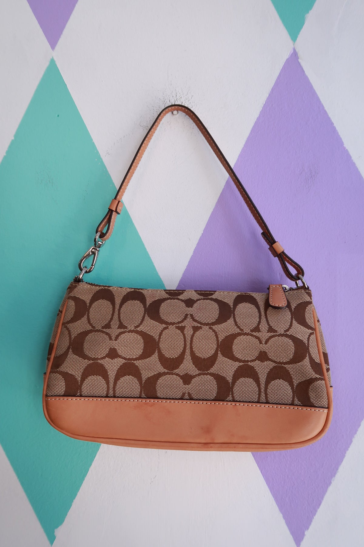Vintage 2000s Coach Signature brown monogram canvas baguette shoulder bag with leather accents, stylish and compact.