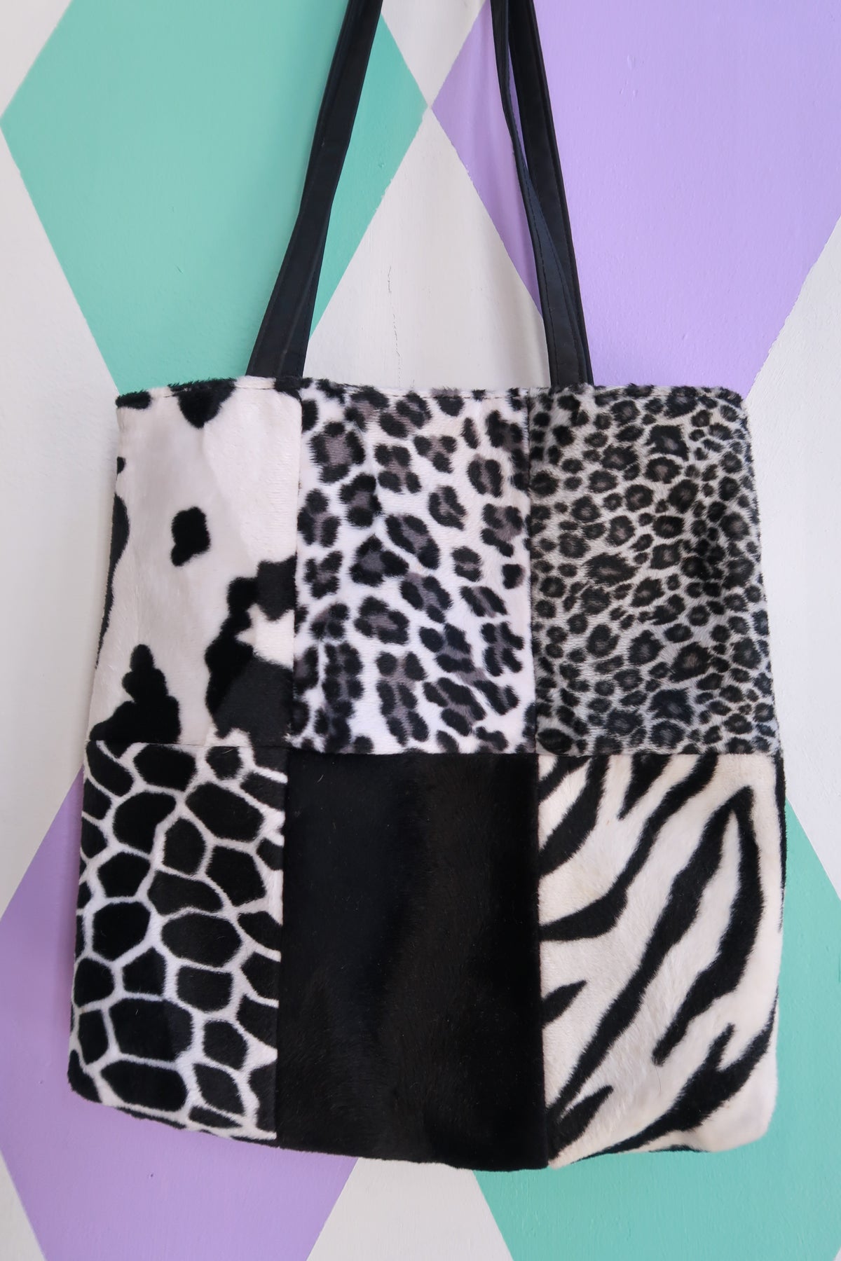 Black and white animal print patchwork faux fur tote bag by Elektra Vintage, showcasing a stylish vintage bag design.