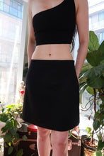 Load image into Gallery viewer, Vintage black wool blend mini skirt by Elektra Vintage, classic A-line tailored design, shown on a neutral background.
