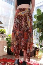 Load image into Gallery viewer, Vintage 2000s Paisley midi skirt by Elektra Vintage, brown and red boho Y2K handkerchief hem skirt with paisley pattern.
