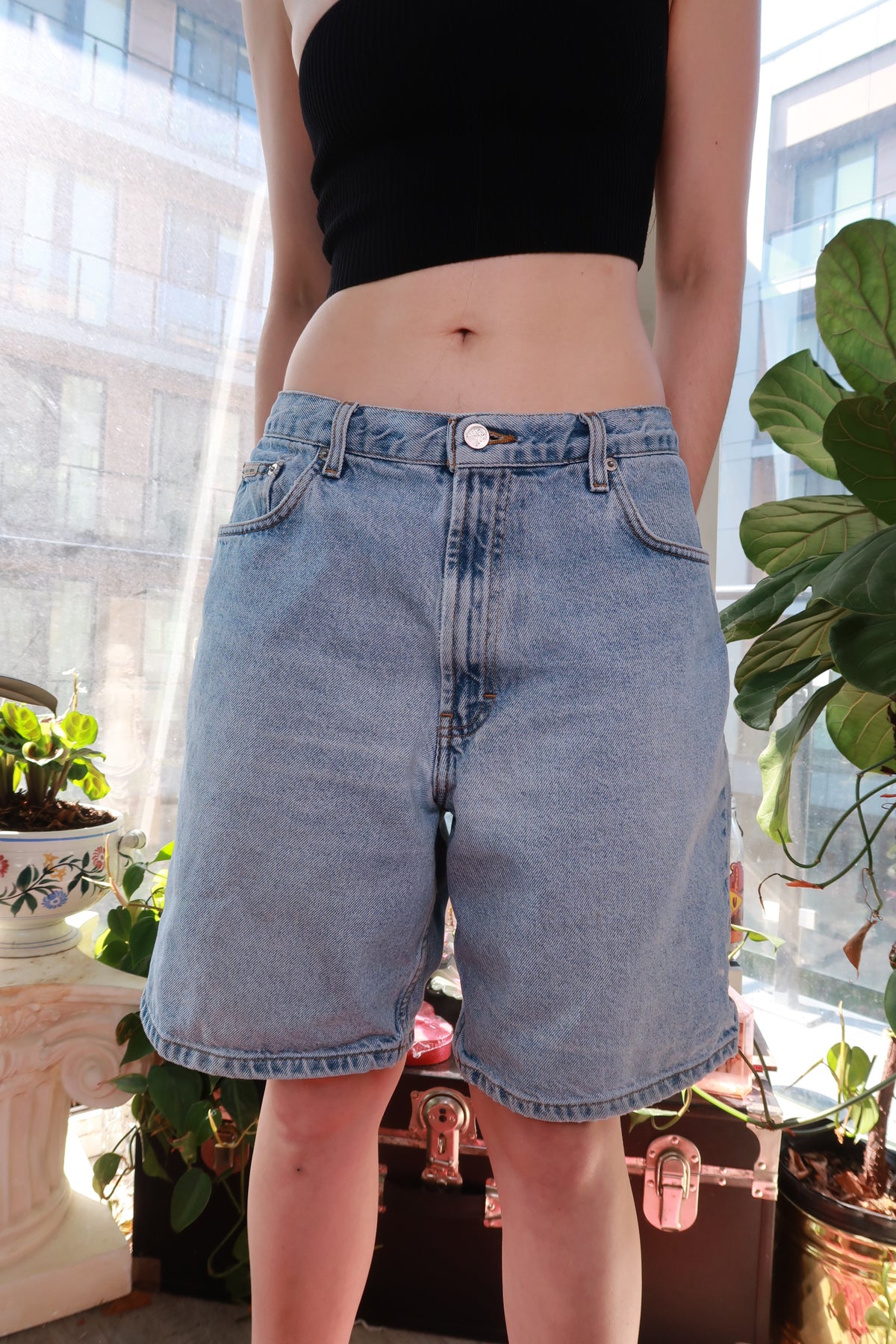 Men's vintage Calvin Klein denim shorts in light wash with a relaxed fit, classic 90s/Y2K style from Elektra Vintage.