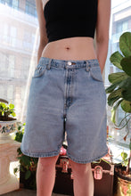 Load image into Gallery viewer, Men's vintage Calvin Klein denim shorts in light wash with a relaxed fit, classic 90s/Y2K style from Elektra Vintage.
