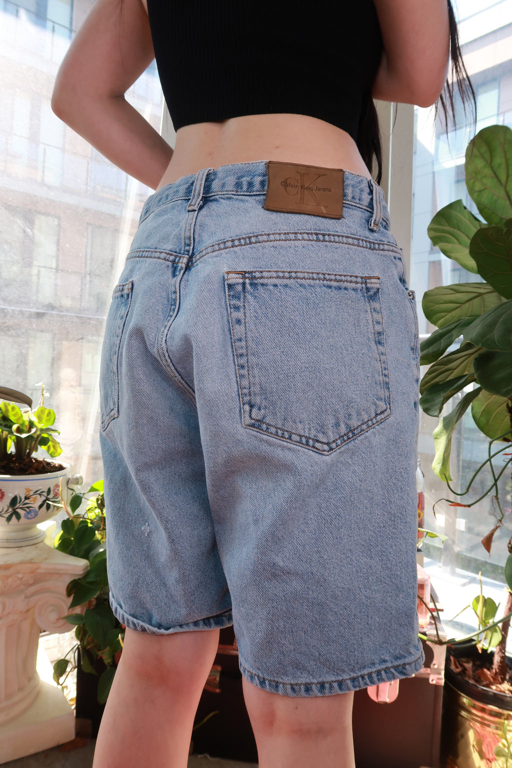 Vintage Calvin Klein denim shorts for men, light wash, relaxed fit, classic 90s/Y2K style from Elektra Vintage.