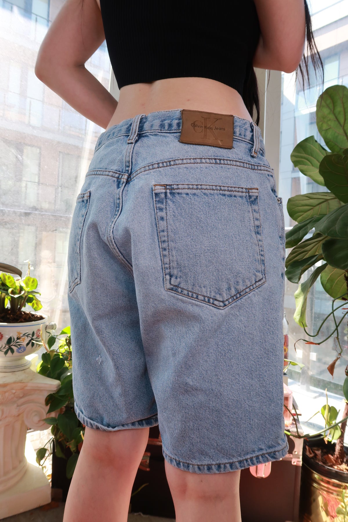 Vintage Calvin Klein denim shorts for men, light wash, relaxed fit, classic 90s/Y2K style from Elektra Vintage.