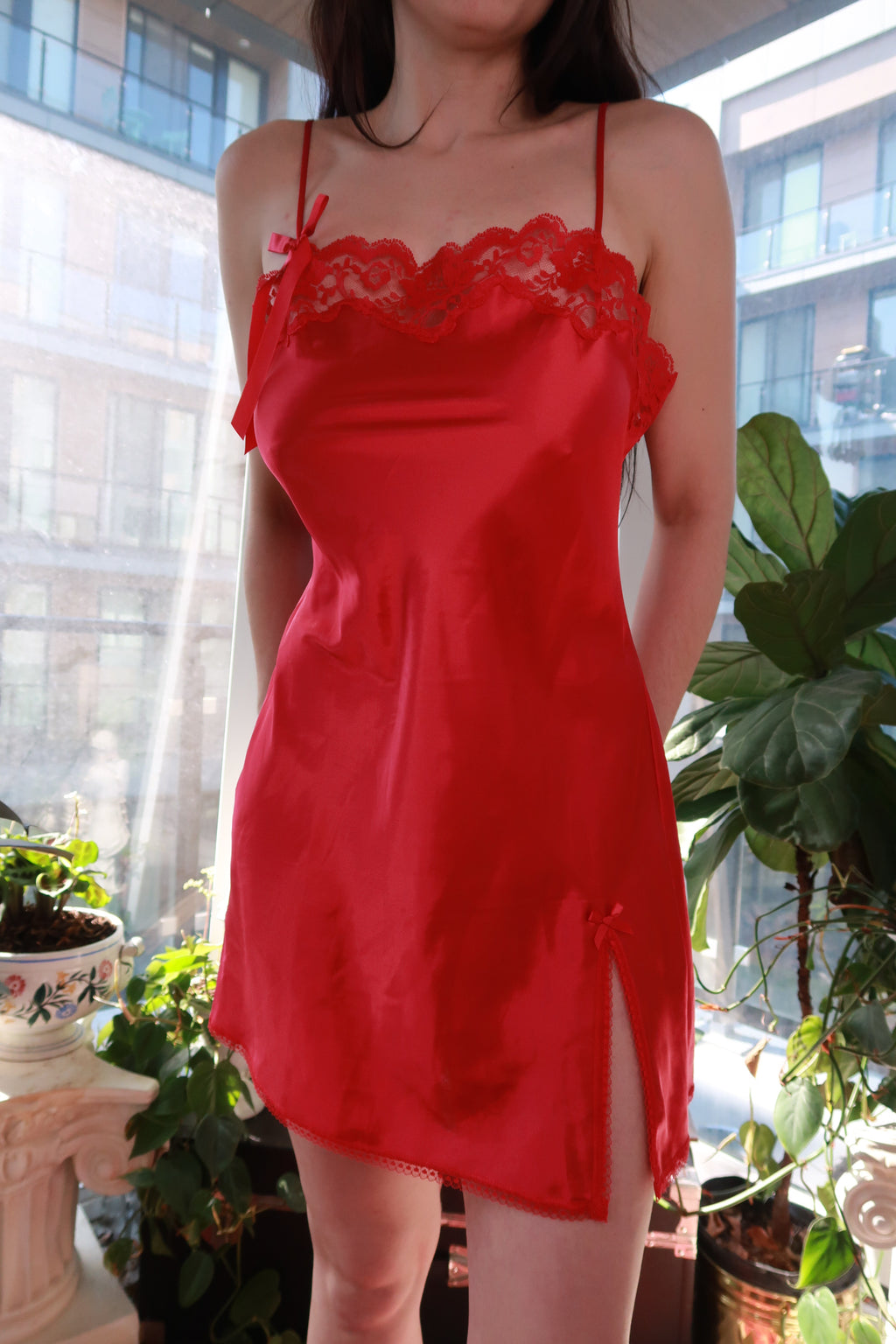 Vintage 2000s Victoria’s Secret red satin slip dress with lace trim and side slit, by Elektra Vintage.
