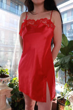 Load image into Gallery viewer, Red satin vintage slip dress by Elektra Vintage featuring lace trim, side slit, mini length, from the 2000s Victoria’s Secret collection.
