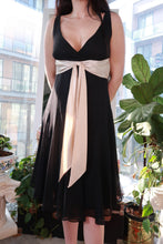 Load image into Gallery viewer, Vintage 2000s black chiffon midi dress with champagne satin waist tie, elegant Elektra Vintage dress for formal occasions.
