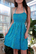 Vintage 2000s turquoise blue smocked halter dress with Y2K leaf print, baby doll mini style from Elektra Vintage.