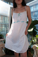 Load image into Gallery viewer, White vintage 2000s babydoll slip dress with Y2K floral trim, ribbon accents, mini sundress style by Elektra Vintage.
