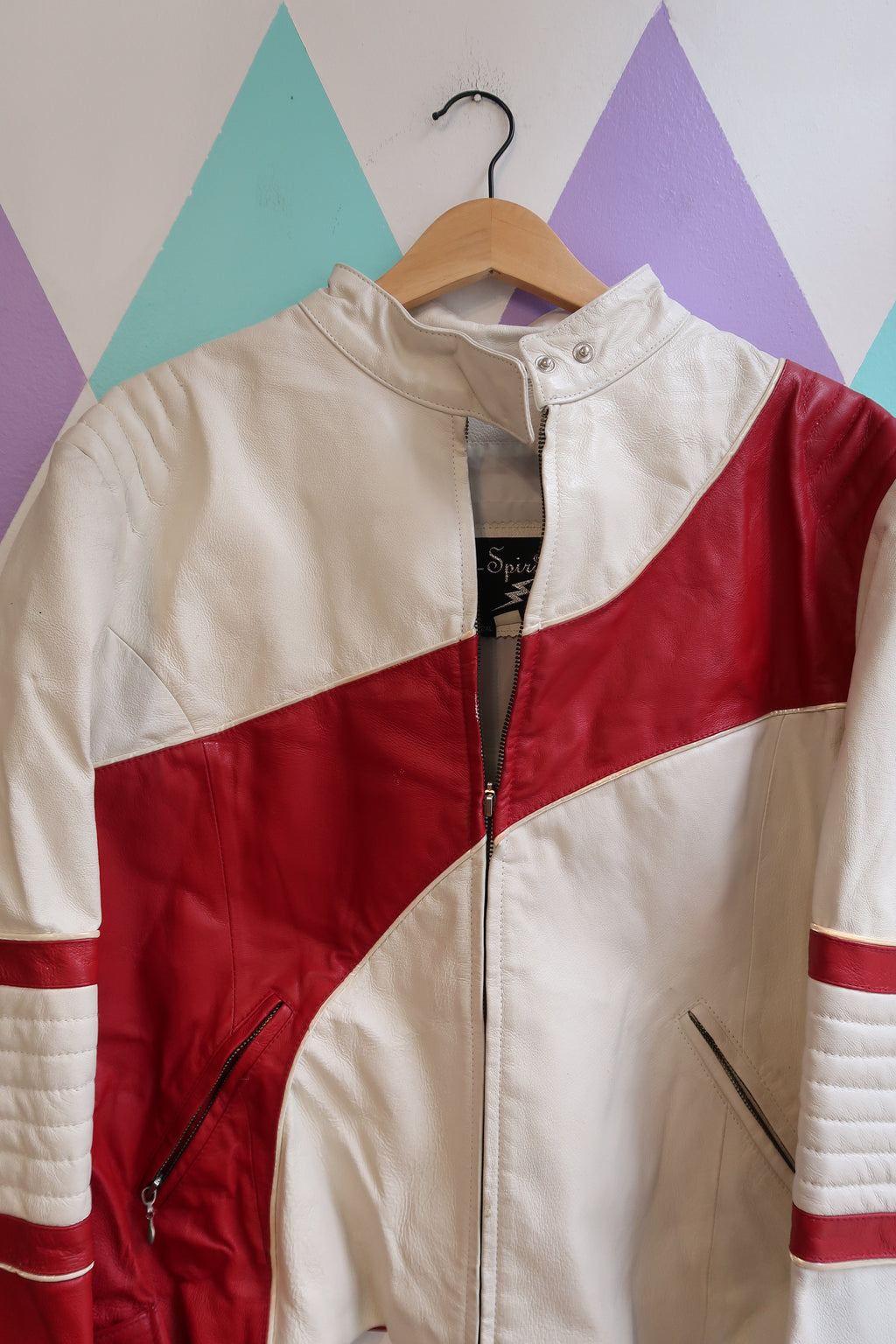 Vintage red and white leather moto jacket by Elektra Vintage, showing the classic style and detailed stitching.