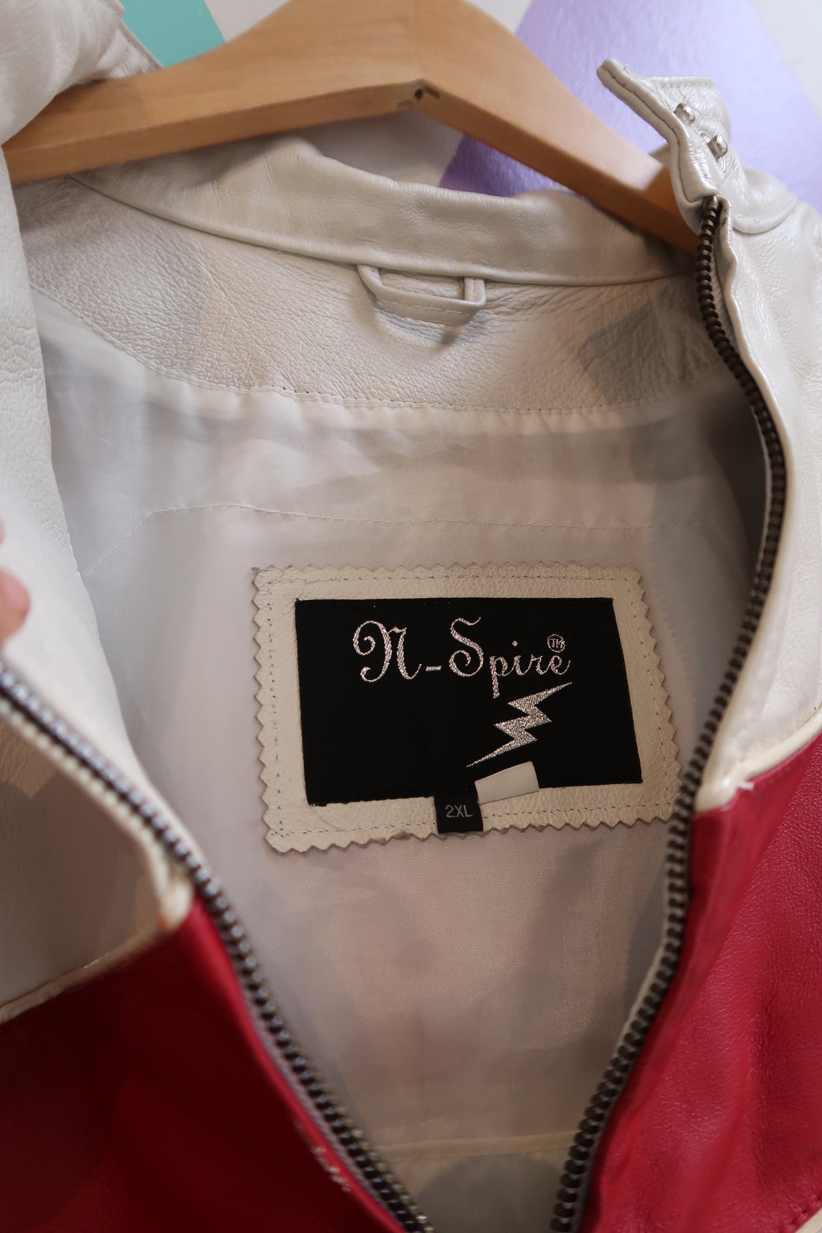 Vintage red and white leather moto jacket by Elektra Vintage, featuring classic style and detailed stitching.
