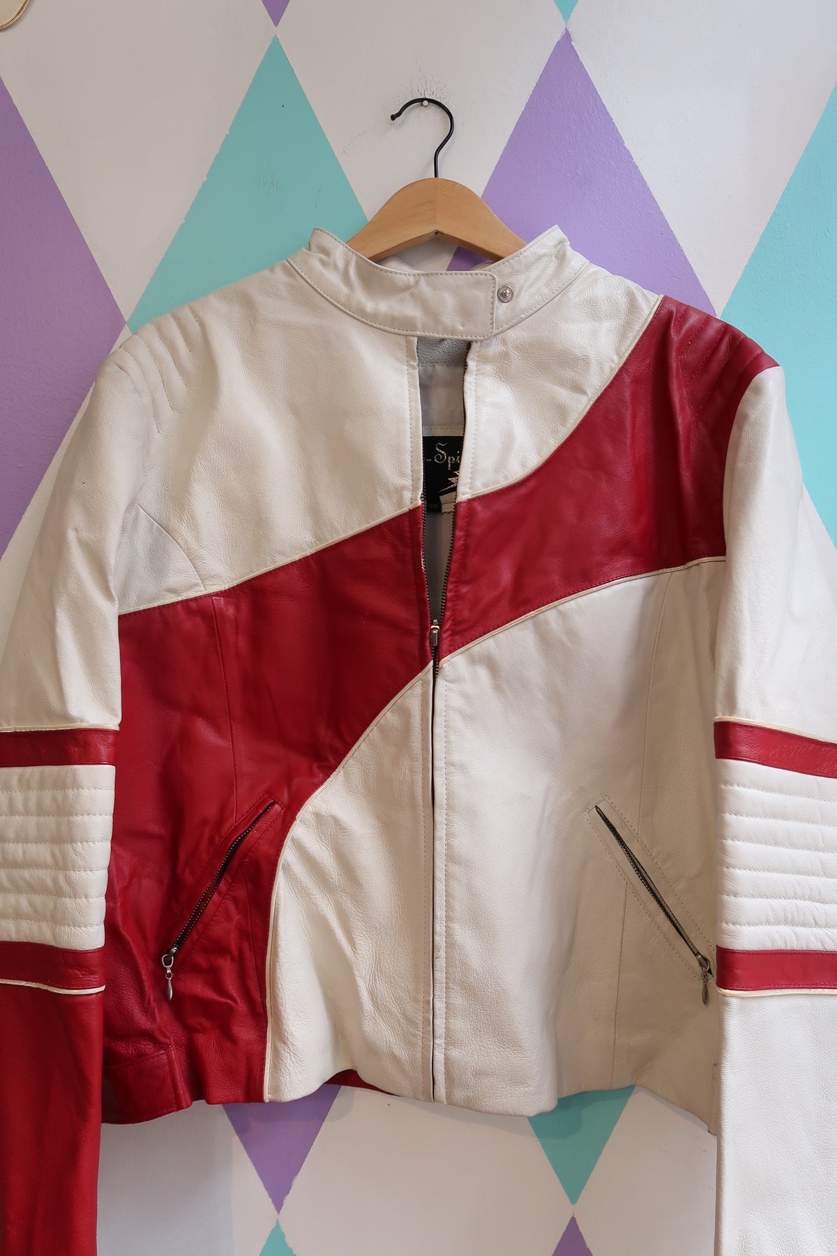 Vintage red and white leather moto jacket by Elektra Vintage, featuring classic design and detailed stitching.