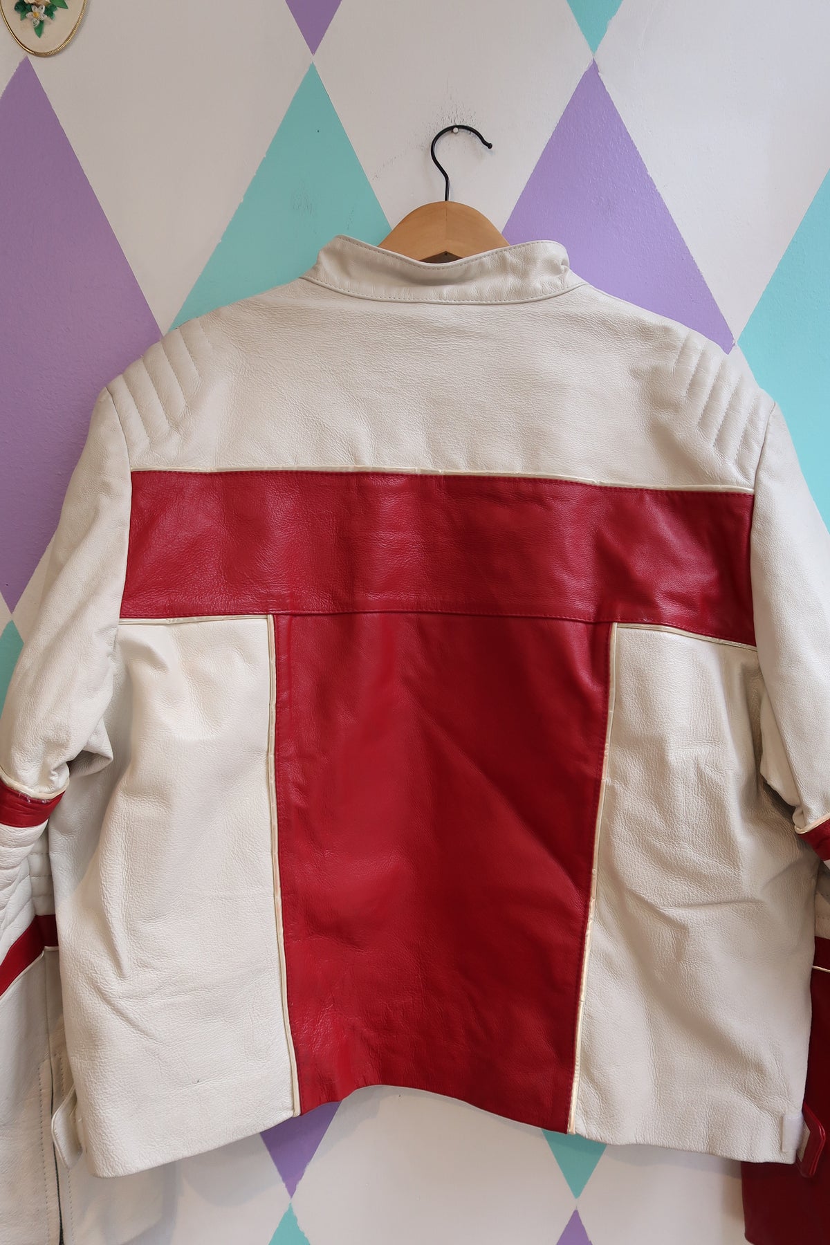 Vintage red and white leather moto jacket by Elektra Vintage with classic style and detailed stitching.