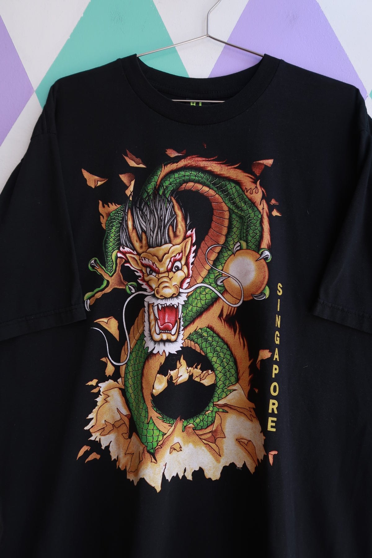 Black men's vintage 2000s Dragon graphic T-shirt by Elektra Vintage, double-sided design with vibrant dragon print.