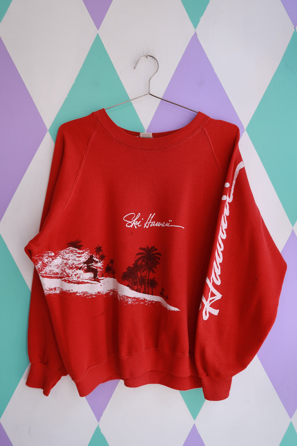 Elektra Vintage men's red crewneck sweatshirt with vintage Hawaii surf scene graphic and ski-themed design.
