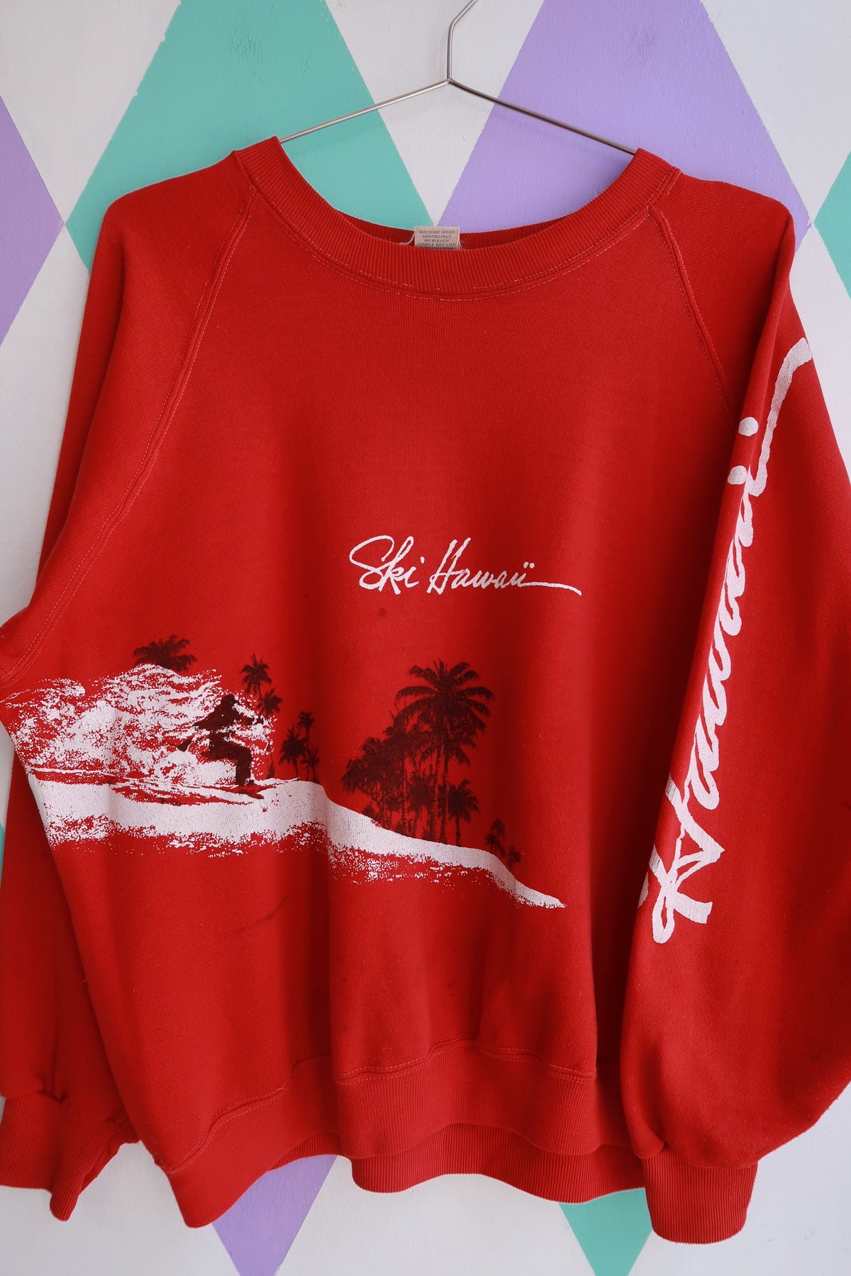 Red vintage ski Hawaii graphic crewneck sweatshirt by Elektra Vintage featuring a surf scene design for men.
