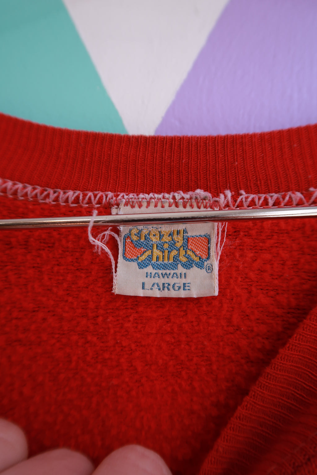 Elektra Vintage men's red crewneck sweatshirt with vintage Hawaii surf scene graphic, featuring a retro ski and surf design.