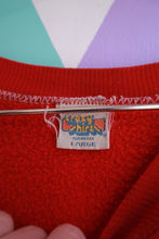 Load image into Gallery viewer, Elektra Vintage men's red crewneck sweatshirt with vintage Hawaii surf scene graphic, featuring a retro ski and surf design.
