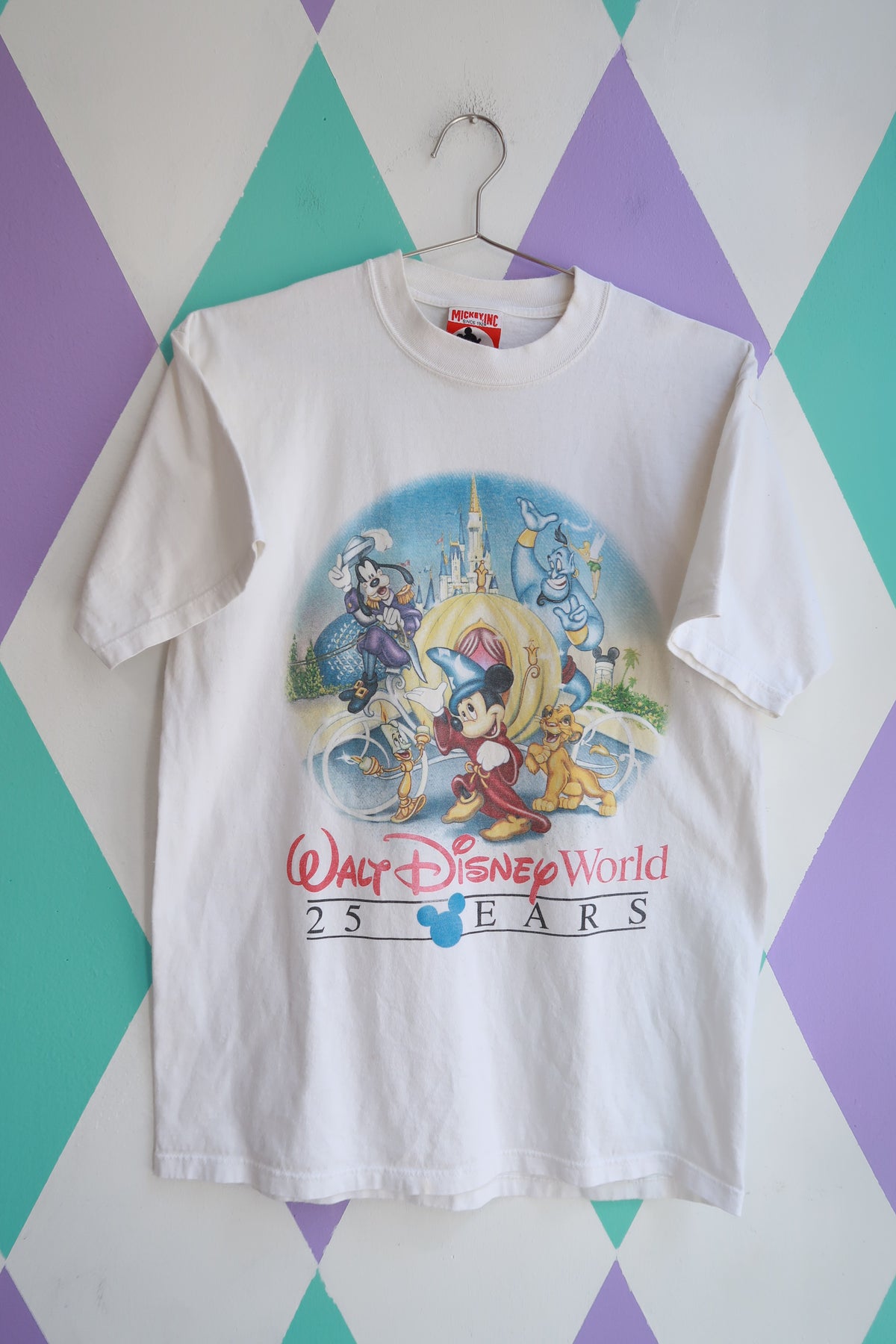 Men's vintage Walt Disney World 25th anniversary Mickey Fantasia castle graphic tee by Elektra Vintage, featuring colorful Disney character artwork.