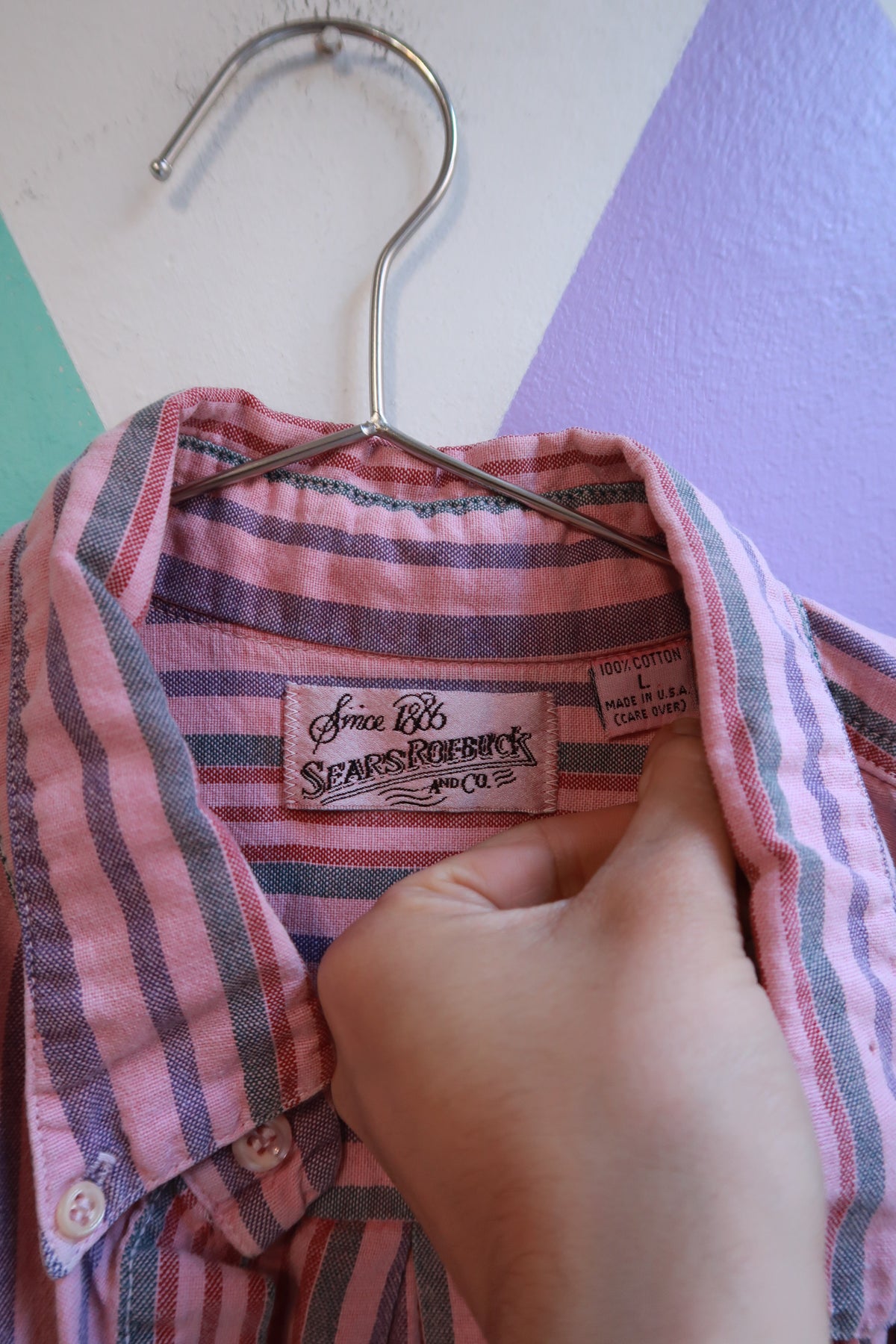 Vintage men's pink striped button-up shirt by Elektra Vintage, showing the classic collar and front buttons on a plain background.