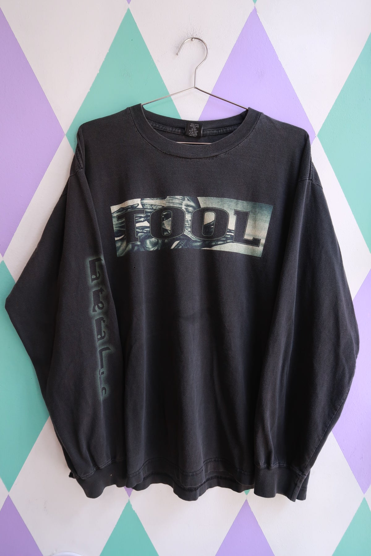 Men's long sleeve graphic T-shirt by Elektra Vintage featuring vintage 2000s Tool band design, with bold printed artwork on front.