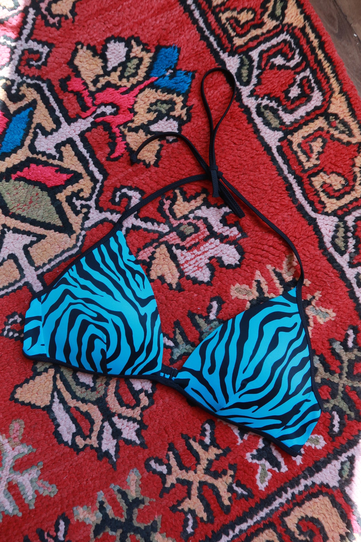 Pink and blue zebra print string bikini top from Elektra Vintage, vintage 2000s swimwear with adjustable ties.
