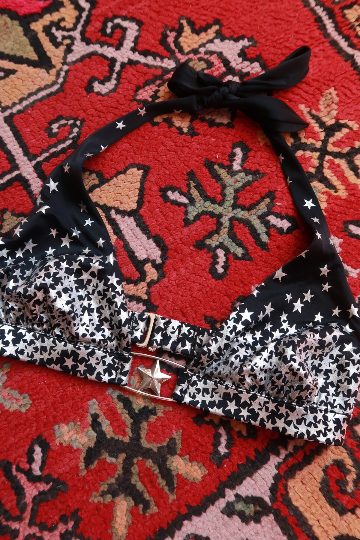 Vintage 2000s Victoria’s Secret star print halter bikini top by Elektra Vintage, featuring a classic star pattern and halter neckline.