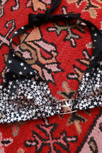Load image into Gallery viewer, Elektra Vintage vintage 2000s Victoria’s Secret star print halter bikini top with adjustable straps and bold star pattern.
