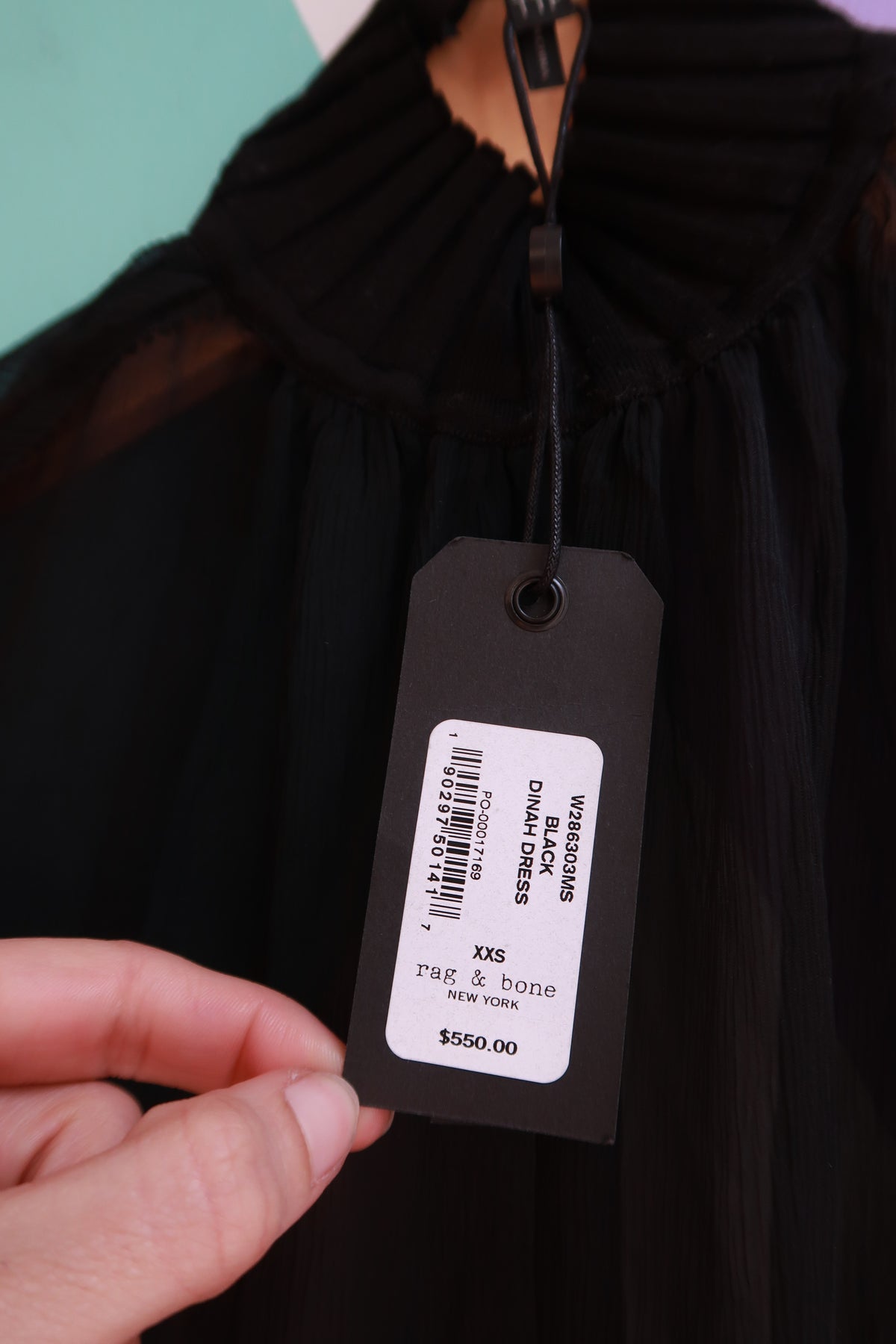 Elektra Vintage black silk midi dress by Rag & Bone featuring sheer fabric and elegant design, displayed on a hanger.