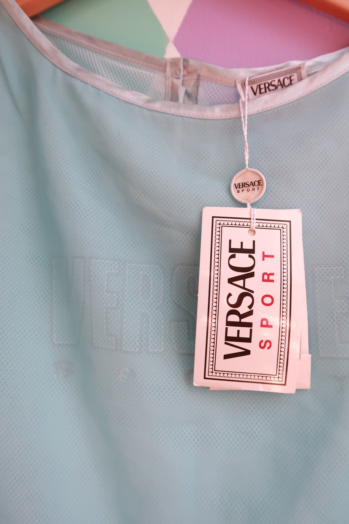 Vintage Versace Ice Blue Sport Sheer Mesh Tank Top for women, featuring a sleek, lightweight design and iconic brand detailing.