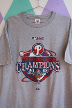 Load image into Gallery viewer, Vintage 2008 Philadelphia Phillies World Series Champions graphic T-shirt by Elektra Vintage, featuring team logo and commemorative design.
