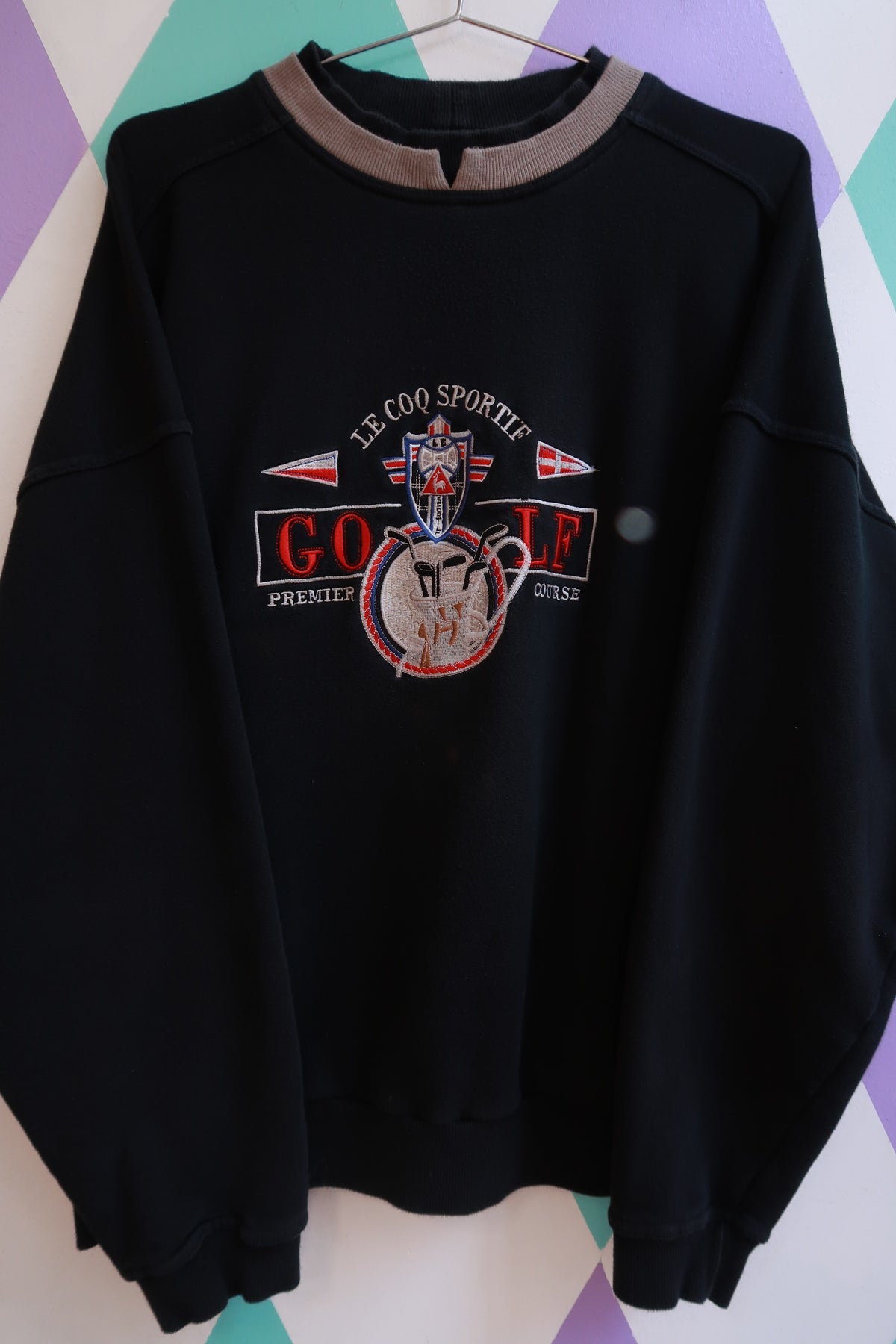 Men's vintage Le Coq Sportif golf embroidered sweatshirt by Elektra Vintage, showcasing a classic design with embroidered logo on the chest.