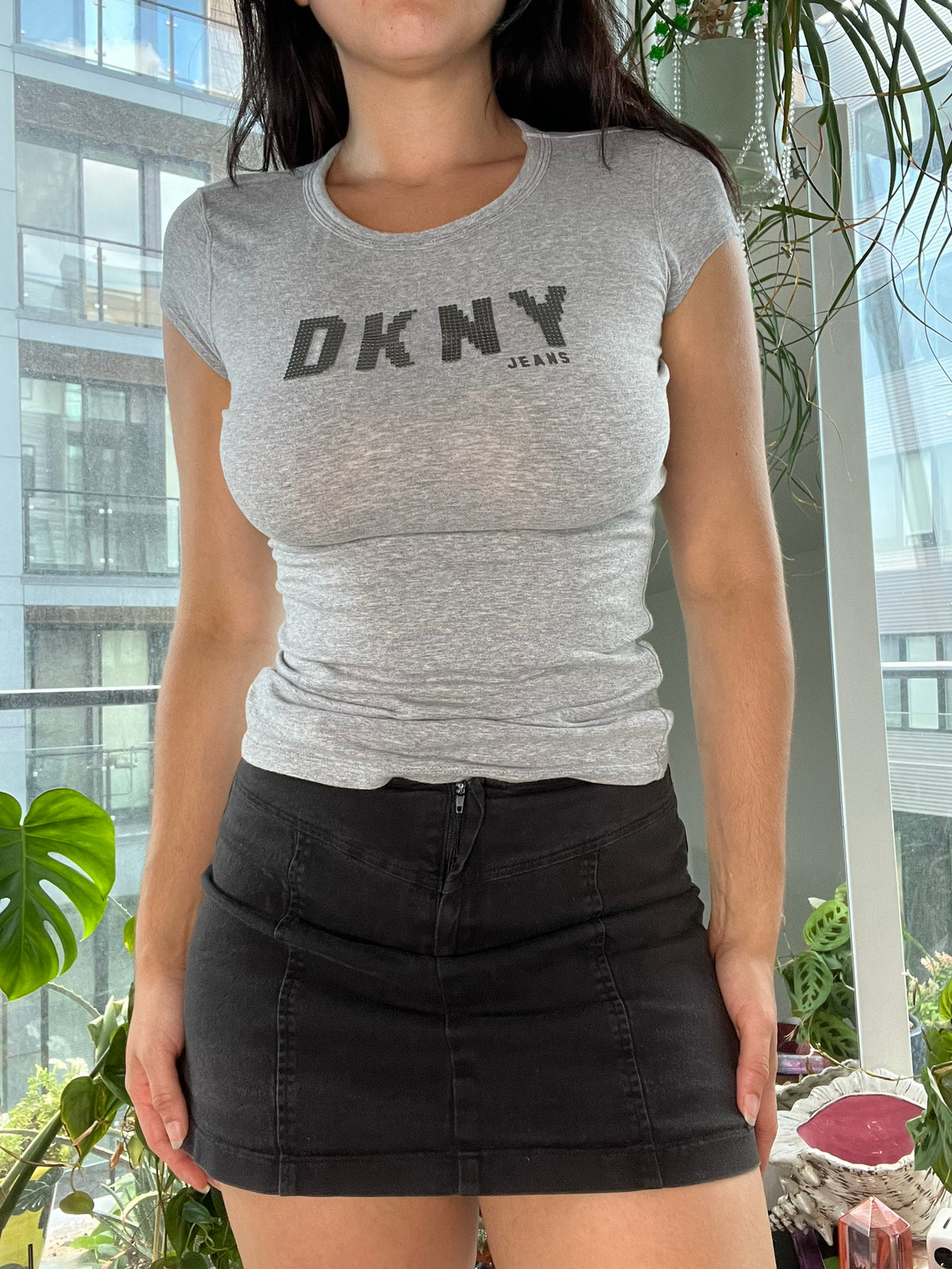 Gray 2000s vintage baby tee for women by DKNY, styled with classic casual fit, from Elektra Vintage collection.