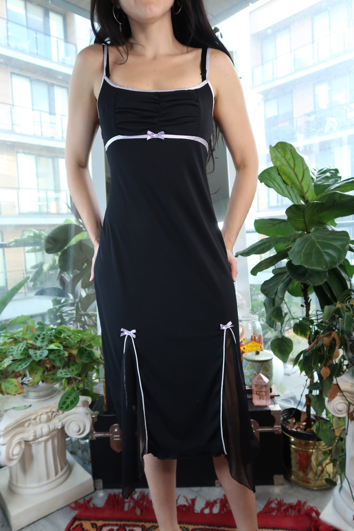 Vintage Elektra Vintage black midi dress with white bows and sheer slits, showcasing elegant design and classic style.