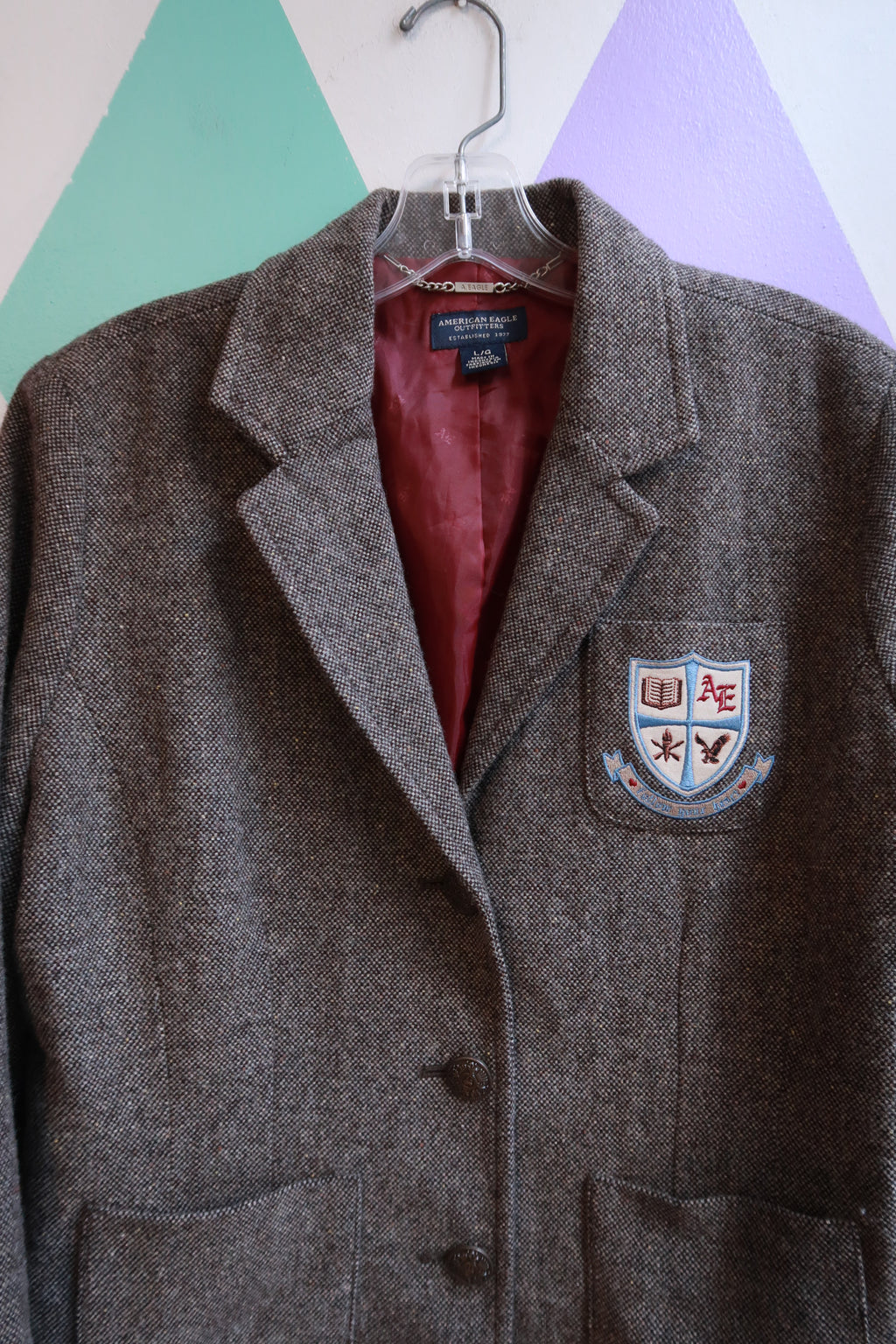 Women's Vintage American Eagle Tweed Crest Blazer jacket from Elektra Vintage, featuring a classic tailored fit and crest embroidery.