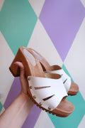 Vintage Italian leather wooden platform clogs by Elektra Vintage, showcasing classic craftsmanship and stylish heel design.