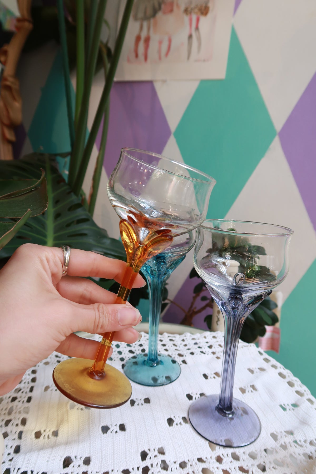 Elektra Vintage colored stem cocktail glasses set featuring amber, blue, and purple wine glasses on a white background.