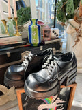 Vintage 90s black platform lace-up oxfords by Bakers, featuring chunky soles and classic leather design, from Elektra Vintage.