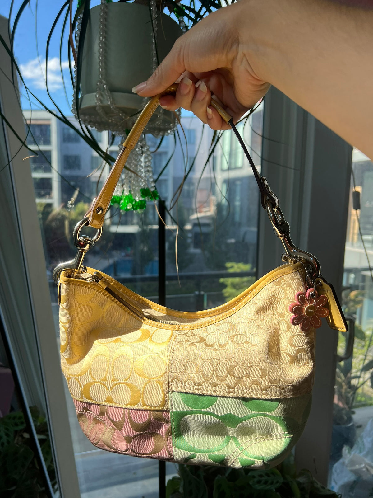 Vintage patchwork multicolor Coach shoulder bag by Elektra Vintage, featuring a stylish multicolor patchwork design with shoulder strap.
