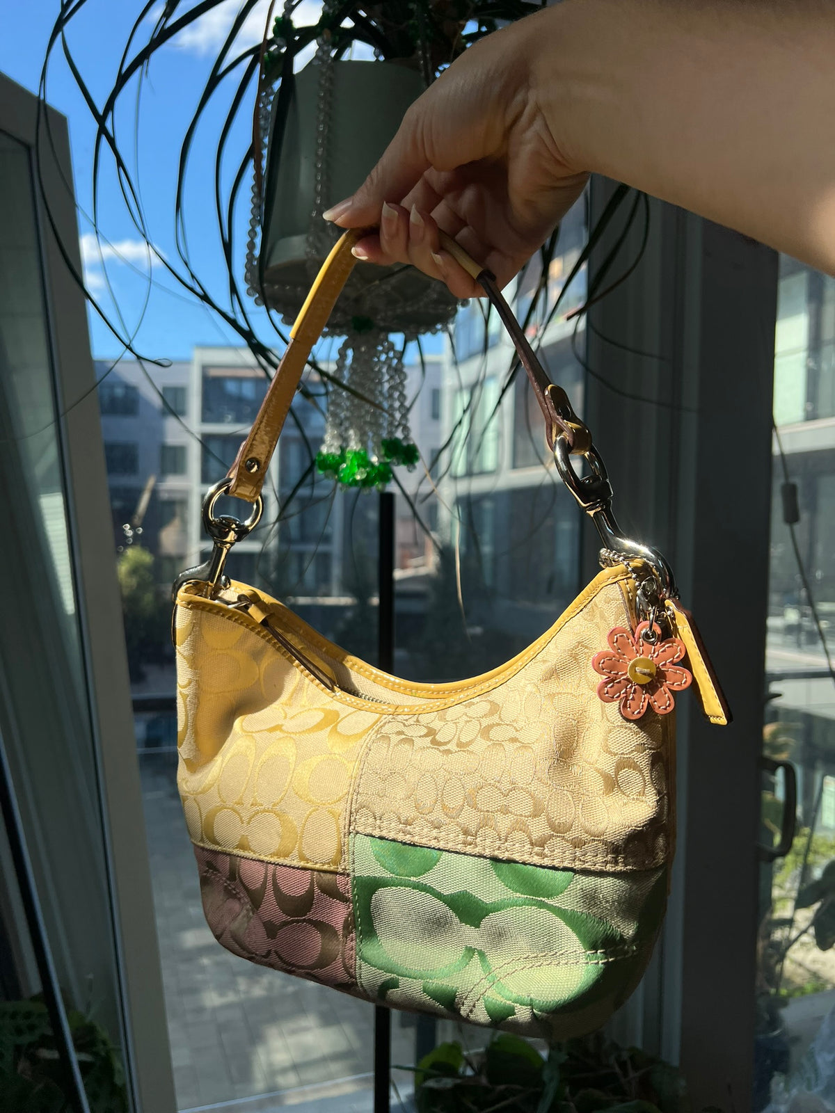 Vintage patchwork multicolor Coach shoulder bag by Elektra Vintage, featuring a stylish multicolored patchwork design.