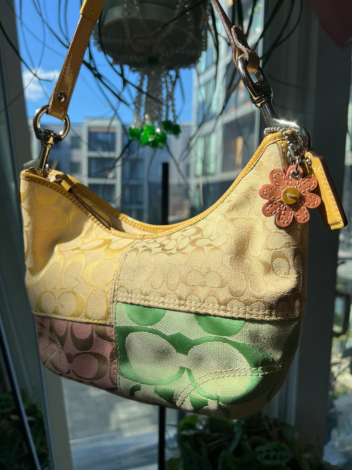 Vintage patchwork multicolor Coach shoulder bag by Elektra Vintage, featuring a stylish design and shoulder strap.