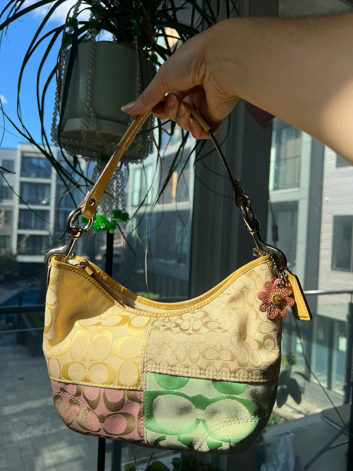 Vintage patchwork multicolor Coach shoulder bag by Elektra Vintage with leather accents and a spacious interior.